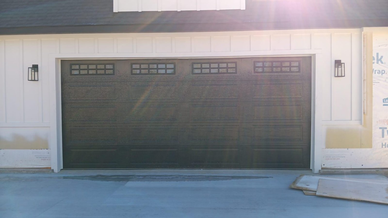 "Expert garage door repair services provided in the 77040 Houston area, showcasing a professional working on a garage door."