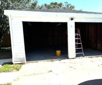"Technician performing garage door repair services in Houston, TX, showcasing the high-quality work of LeMus Garage Door Service."