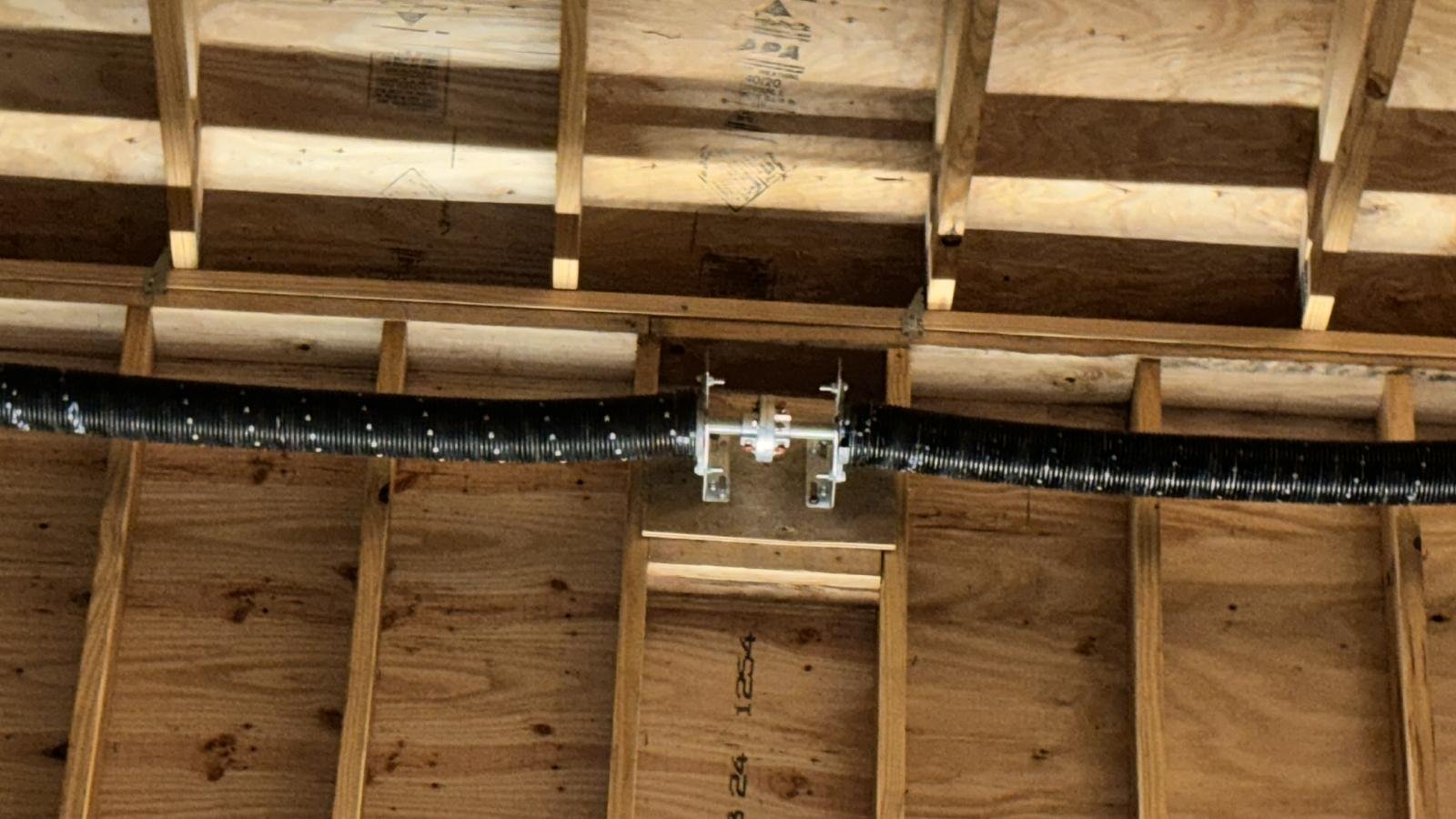 "Garage door torsion spring in Houston, TX, provided by Lemus Garage Door Service."