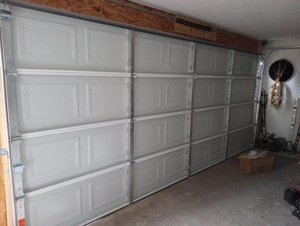 "Newly installed garage door by LeMus Garage Door Service in Houston, showcasing professional workmanship and quality materials."